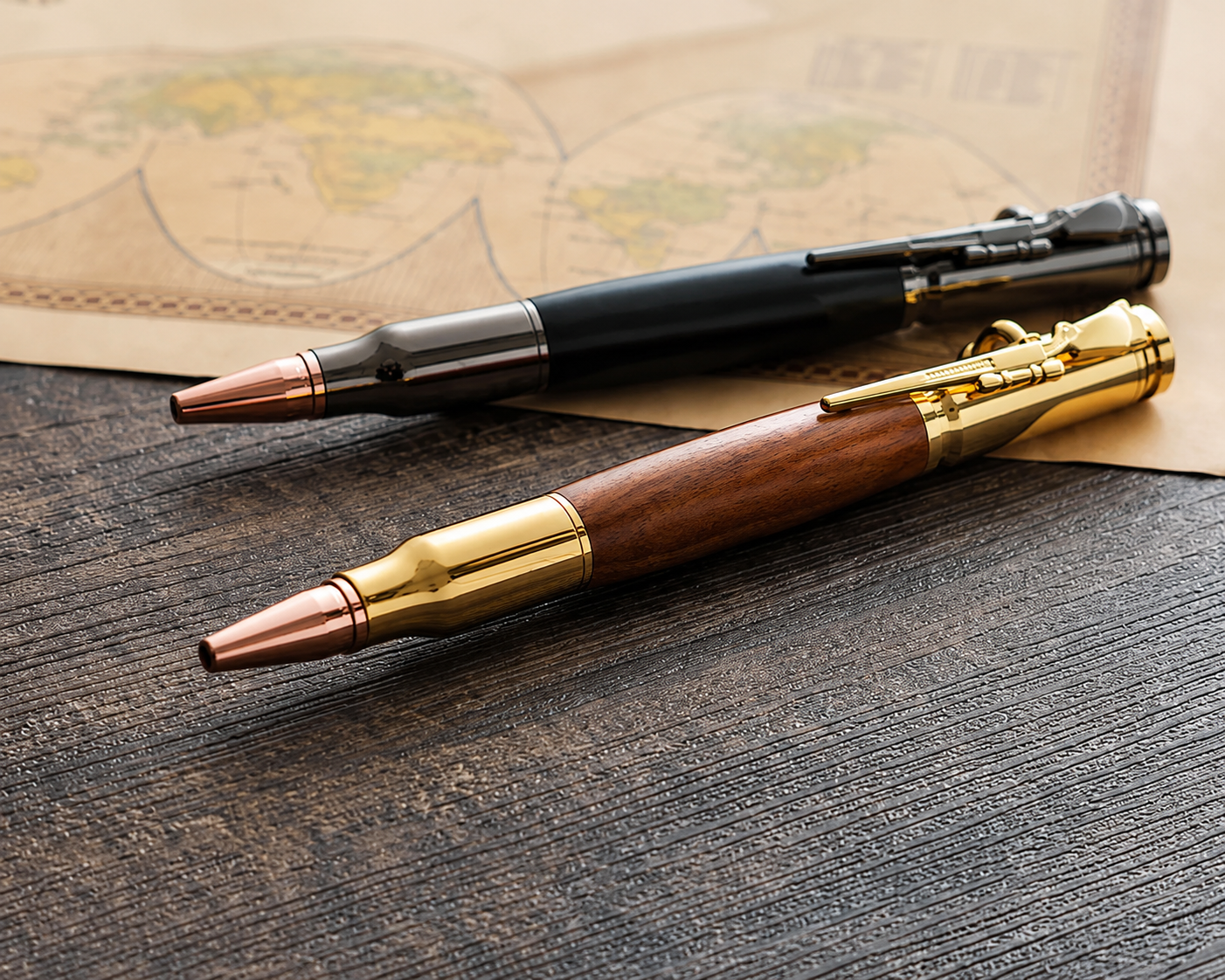 Natural wood and black bolt action pens displayed on a vintage map