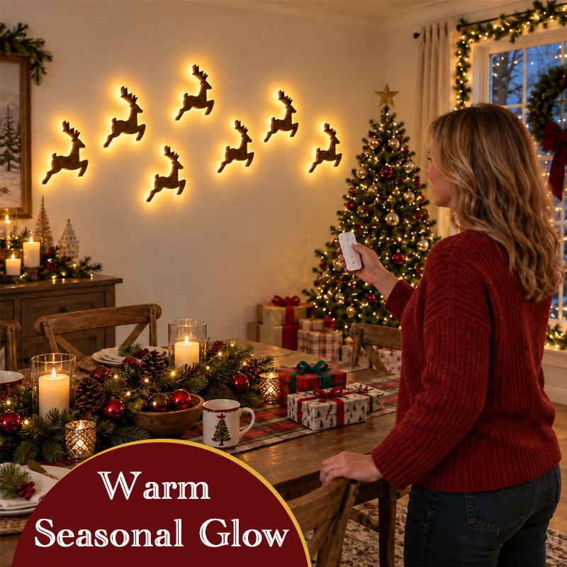 Warm glowing reindeer wall decorations beside Christmas tree and dining table