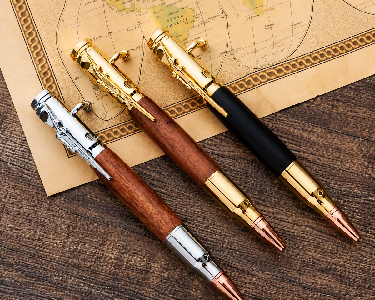 Gold silver and black bolt action pens displayed together