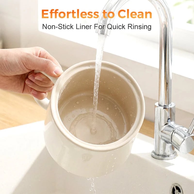 Wide mouth ceramic glaze electric cooking cup being rinsed clean