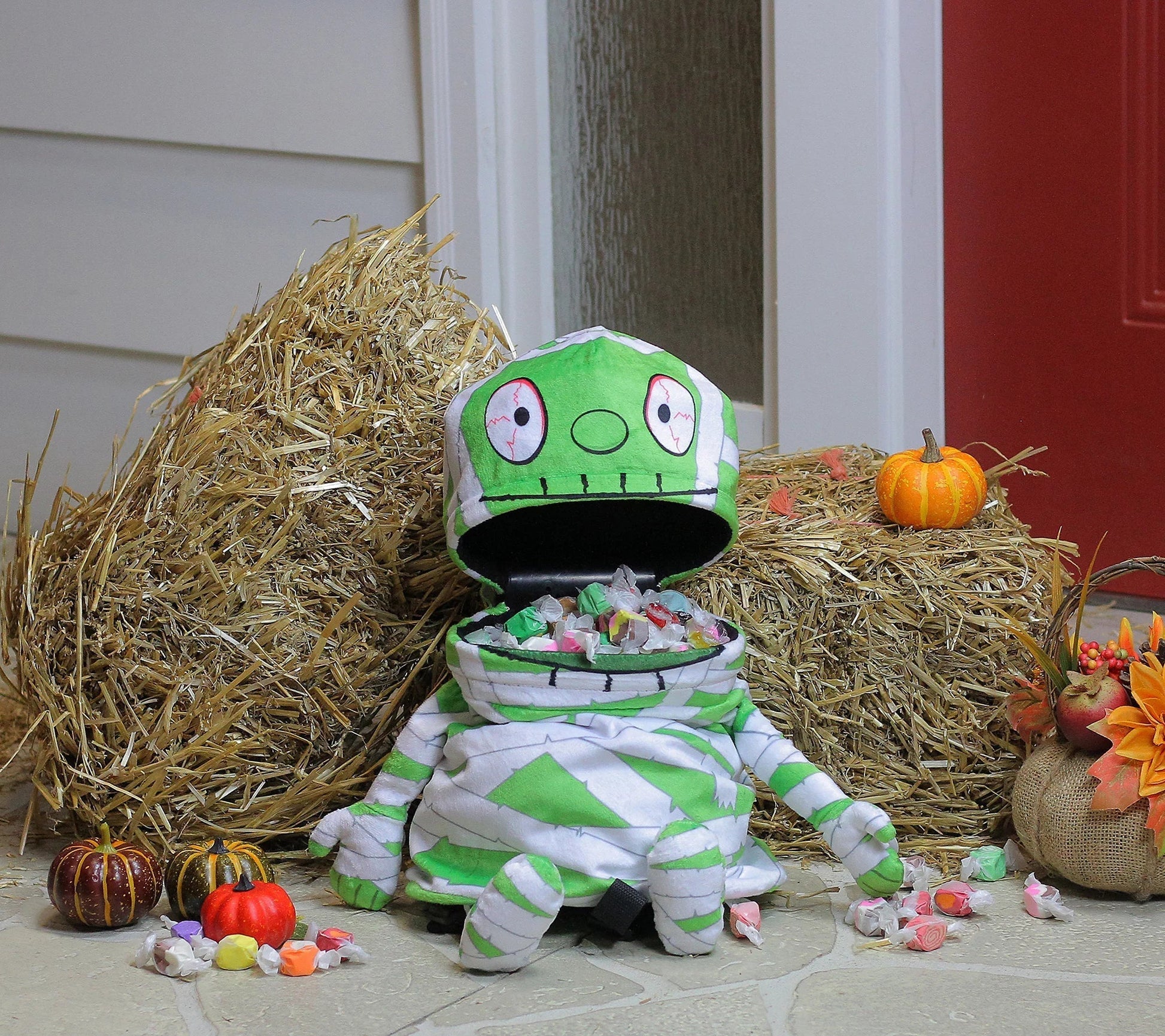 Animated mummy candy bag filled with Halloween candy