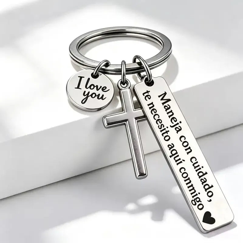 Silver cross I love you keychain with Spanish drive safely inscription