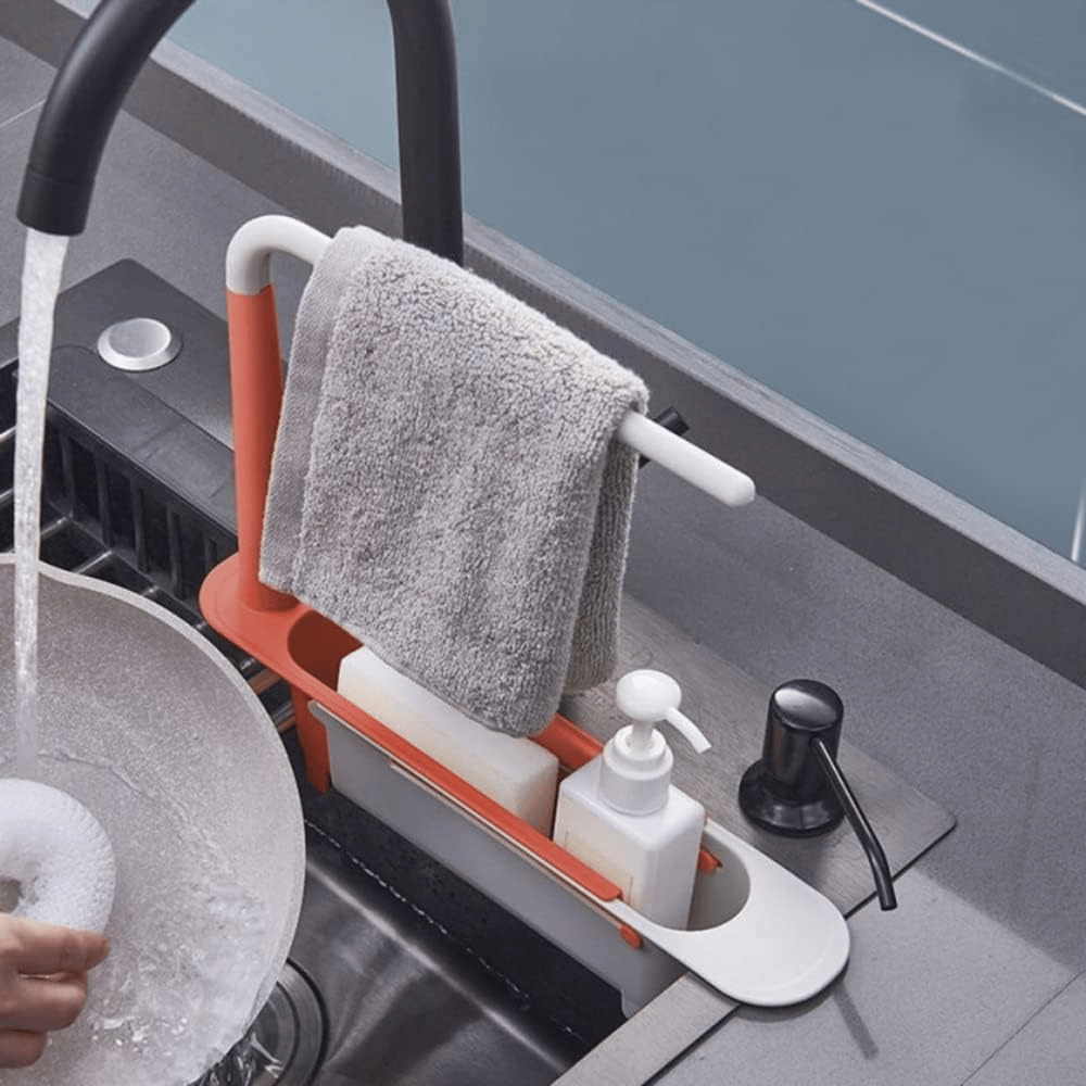 Red telescopic sink organizer with towel rail sponge and soap storage