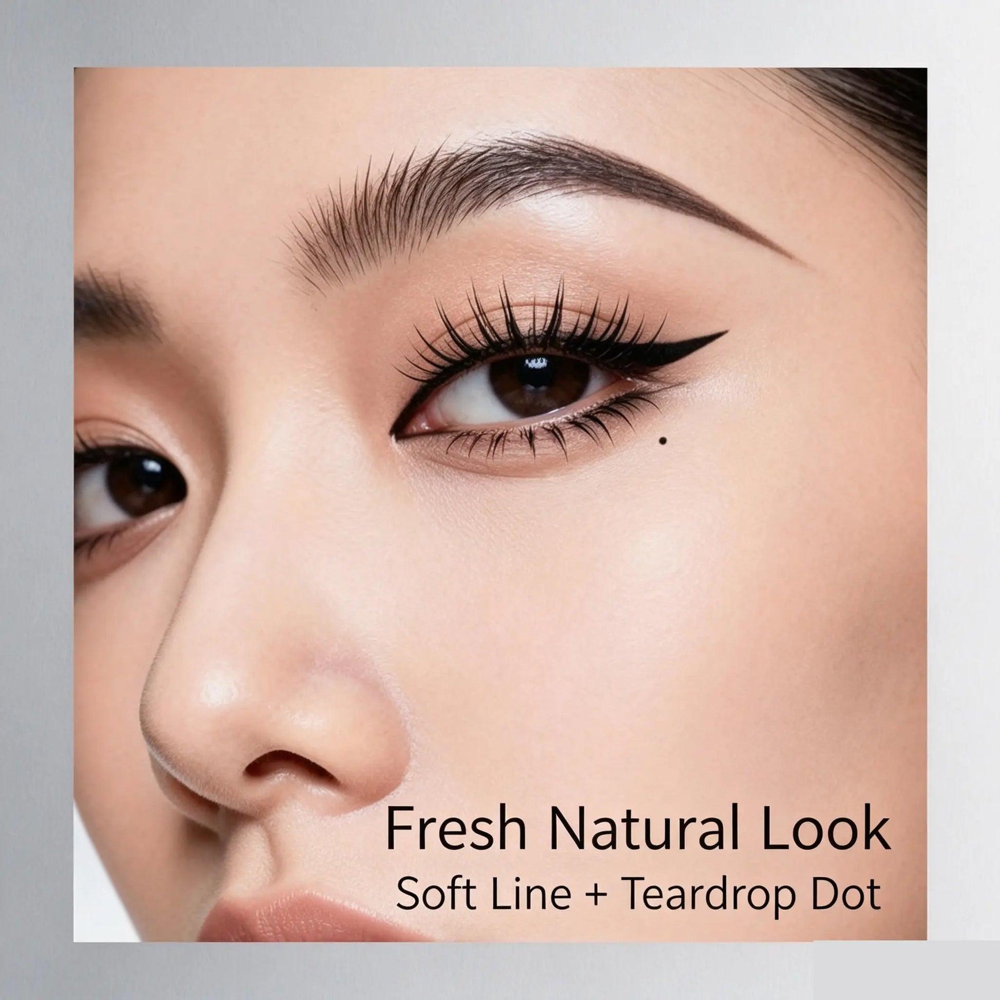 Finished eye makeup look with wing eyeliner lower lashes and beauty mark
